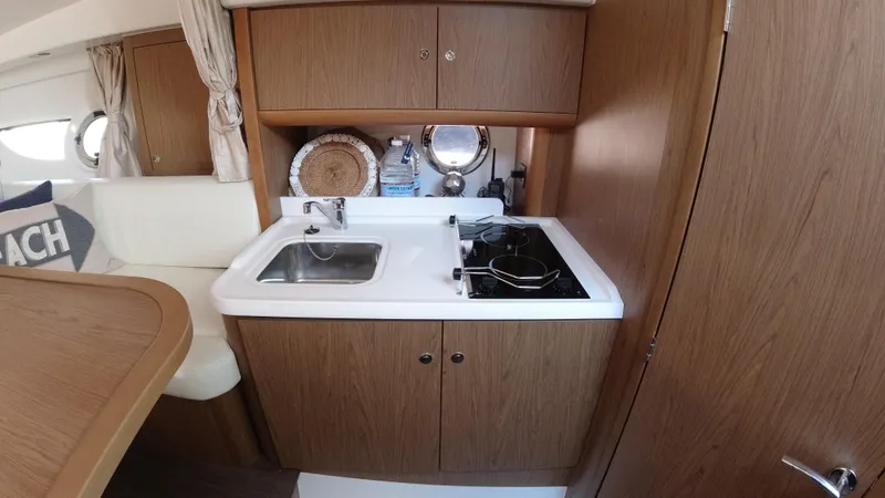  Yacht Photos Pics Compact kitchen area in 2016 Beneteau GT35 yacht with sink and stove.