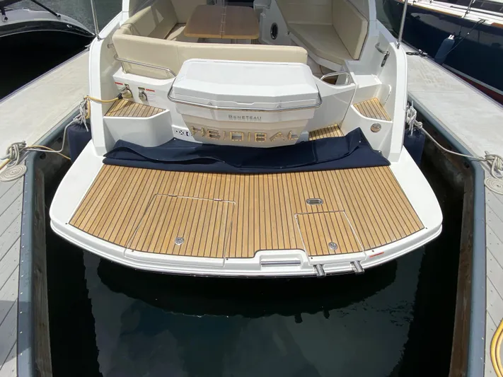  Yacht Photos Pics 2016 Beneteau GT35 yacht stern view with teak swim platform.