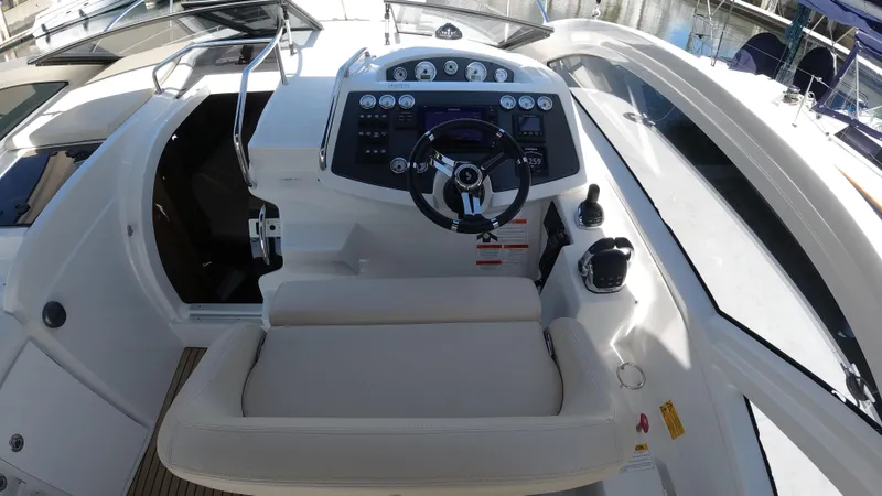  Yacht Photos Pics 2016 Beneteau GT35 helm station with modern controls and comfortable seating.
