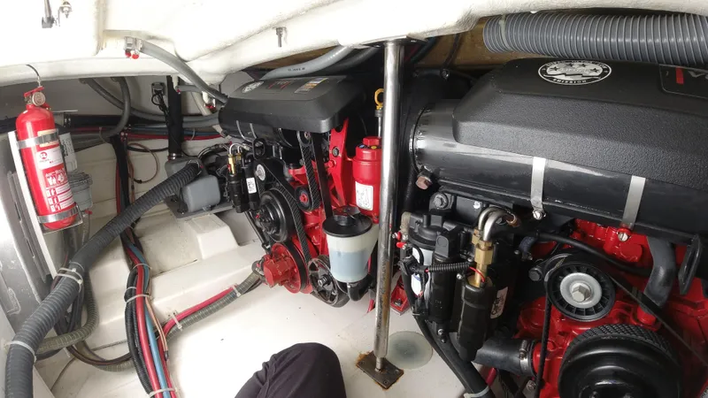 Yacht Photos Pics Engine room of a 2016 Beneteau GT35 boat with dual engines and fire extinguisher.