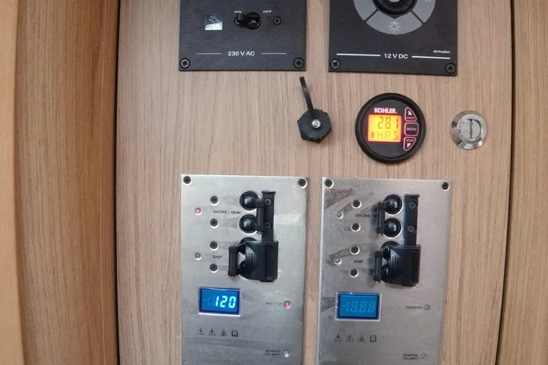  Yacht Photos Pics Control panel of a 2016 Beneteau GT35 yacht with digital displays and switches.