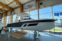 2023 Quarken 27 T-Top V2 boat displayed in a showroom.