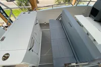 2023 Quarken 27 T-Top V2 boat interior with seating and storage area.