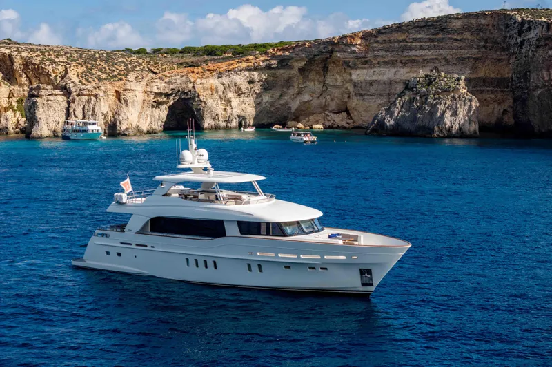 Firefly Yacht Photos Pics Luxury Mulder 94 yacht cruising near scenic cliffs, 2015 model.