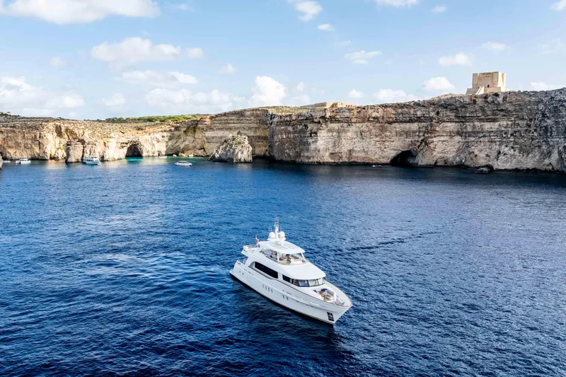 Firefly Yacht Photos Pics Luxury Mulder 94 yacht cruising near scenic cliffs, 2015 model.