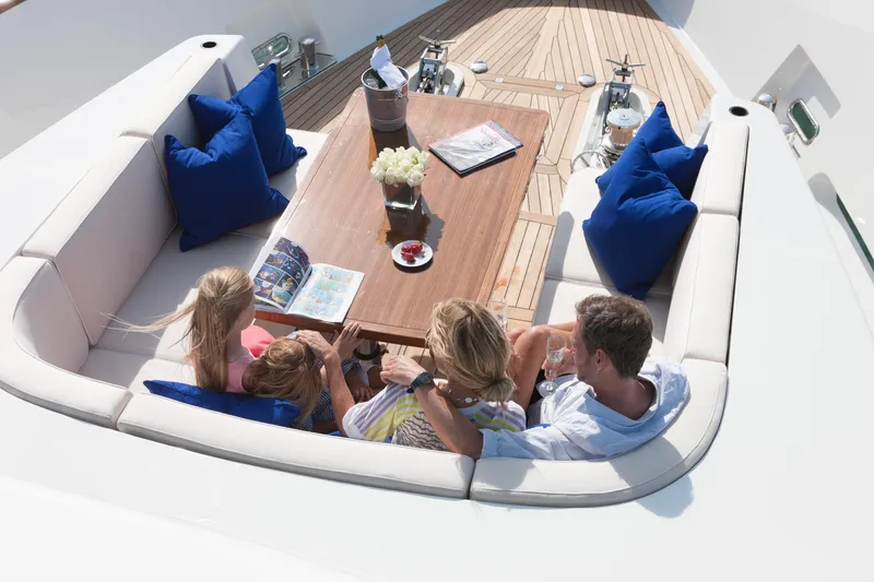Firefly Yacht Photos Pics Family relaxing on a Mulder 94 yacht, enjoying leisure time on deck, 2015 model.
