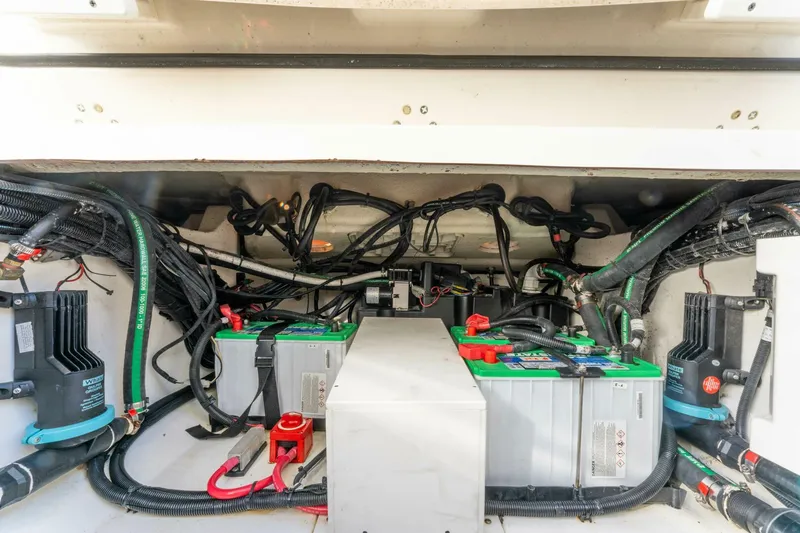 Sutra Yacht Photos Pics 2017 Boston Whaler 320 Vantage engine compartment with batteries and wiring.