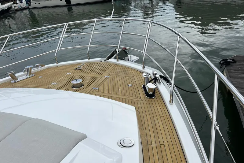 Yacht Photos Pics Bow of 2020 Azimut Grande 25M yacht with teak decking and stainless steel railings.