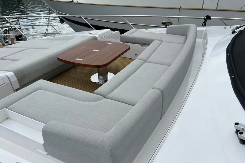  Yacht Photos Pics Luxurious seating area on 2020 Azimut Grande 25M yacht with wooden table.