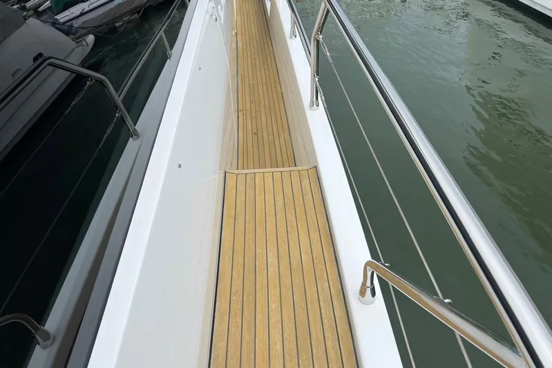  Yacht Photos Pics Walkway on 2020 Azimut Grande 25M yacht with teak decking and stainless steel railings.