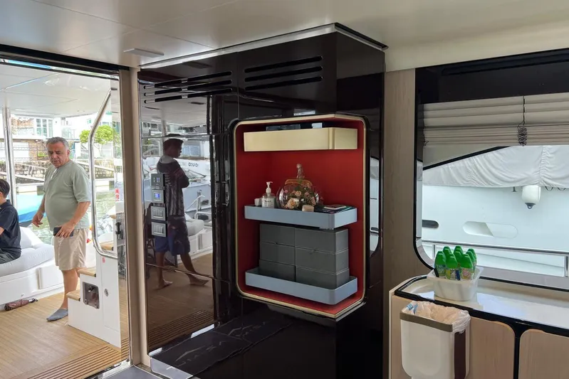  Yacht Photos Pics Interior of 2020 Azimut Grande 25M yacht with modern decor and people onboard.