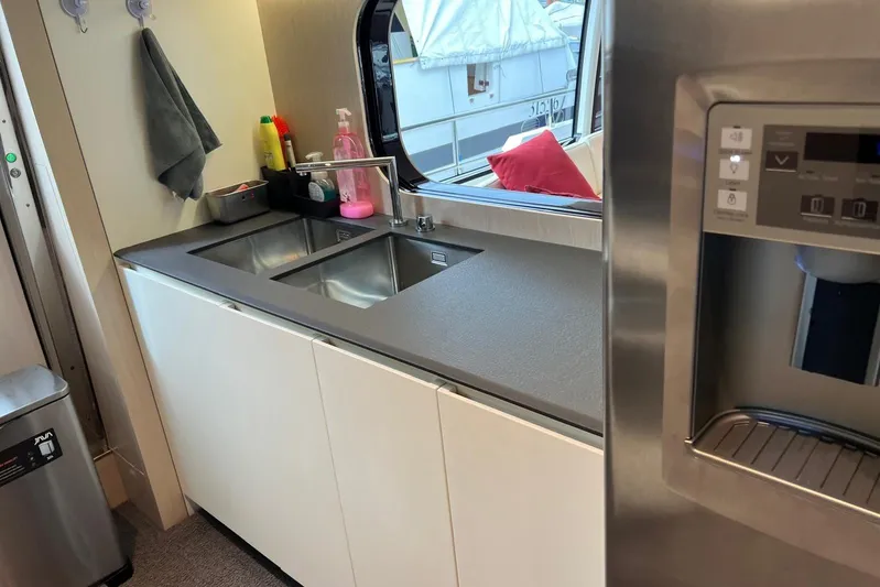  Yacht Photos Pics Modern kitchen area on 2020 Azimut Grande 25M yacht with sleek sink and appliances.