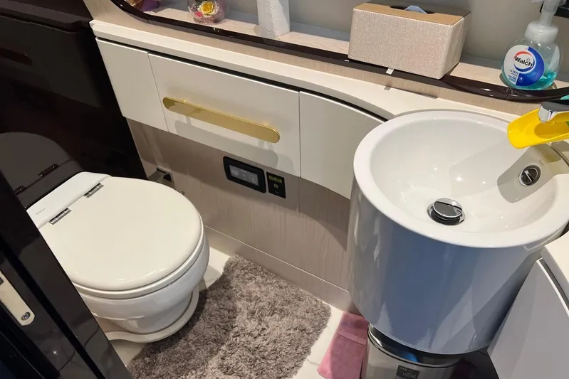  Yacht Photos Pics Luxurious bathroom in 2020 Azimut Grande 25M yacht with modern fixtures and elegant design.