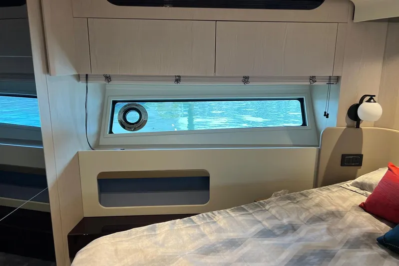  Yacht Photos Pics Luxurious Azimut Grande 25M 2020 yacht bedroom interior with window view.
