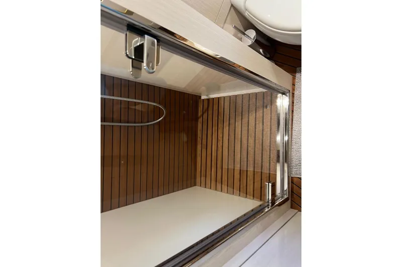  Yacht Photos Pics Luxurious shower area on 2020 Azimut Grande 25M yacht with wood paneling.