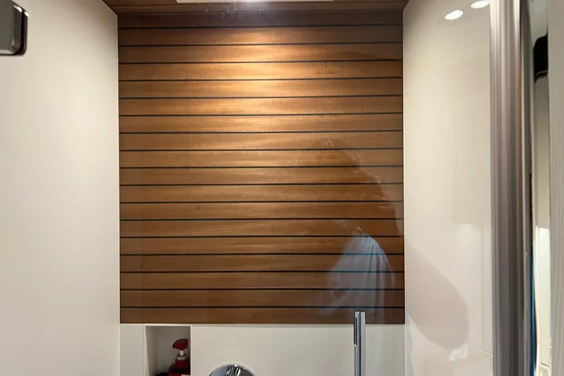  Yacht Photos Pics Wood-paneled interior of 2020 Azimut Grande 25M yacht bathroom.