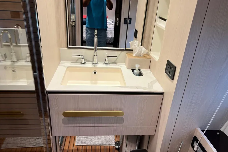  Yacht Photos Pics Luxurious bathroom sink in 2020 Azimut Grande 25M yacht, featuring modern fixtures and elegant design.