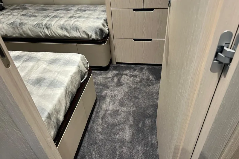  Yacht Photos Pics Interior cabin of 2020 Azimut Grande 25M yacht with twin beds and modern decor.