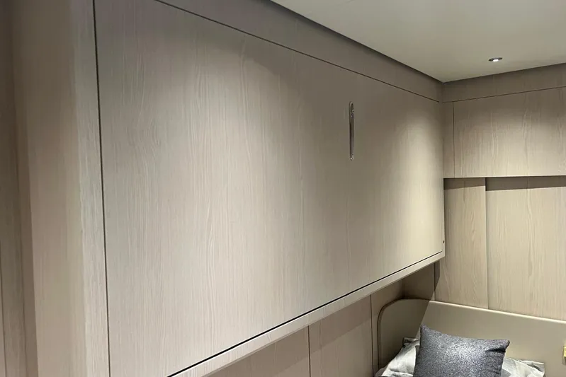  Yacht Photos Pics Luxurious interior of 2020 Azimut Grande 25M yacht with sleek wood paneling.