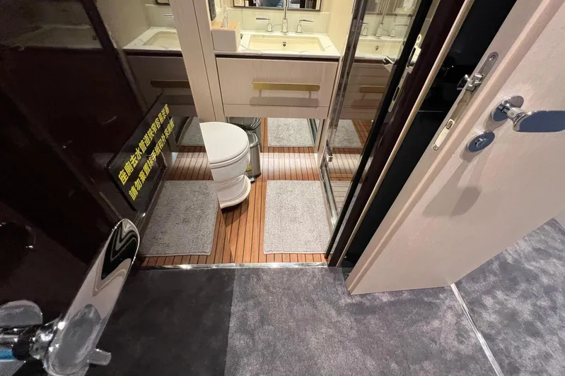  Yacht Photos Pics Luxurious bathroom interior of 2020 Azimut Grande 25M yacht with modern fixtures.