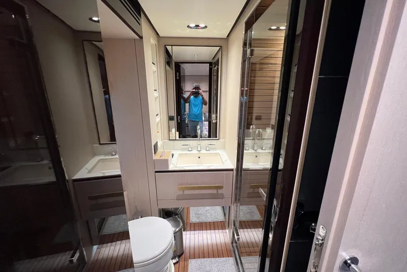  Yacht Photos Pics Luxurious bathroom interior of 2020 Azimut Grande 25M yacht with modern fixtures.