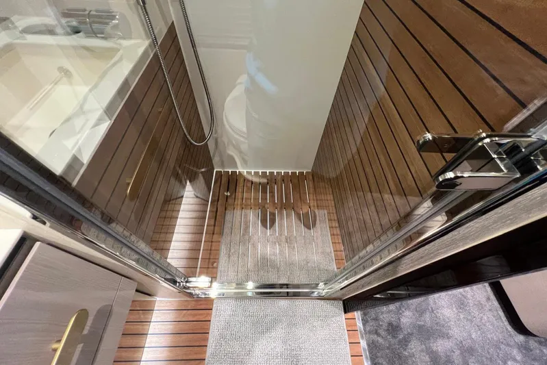  Yacht Photos Pics Luxurious shower area in 2020 Azimut Grande 25M yacht with wooden flooring.