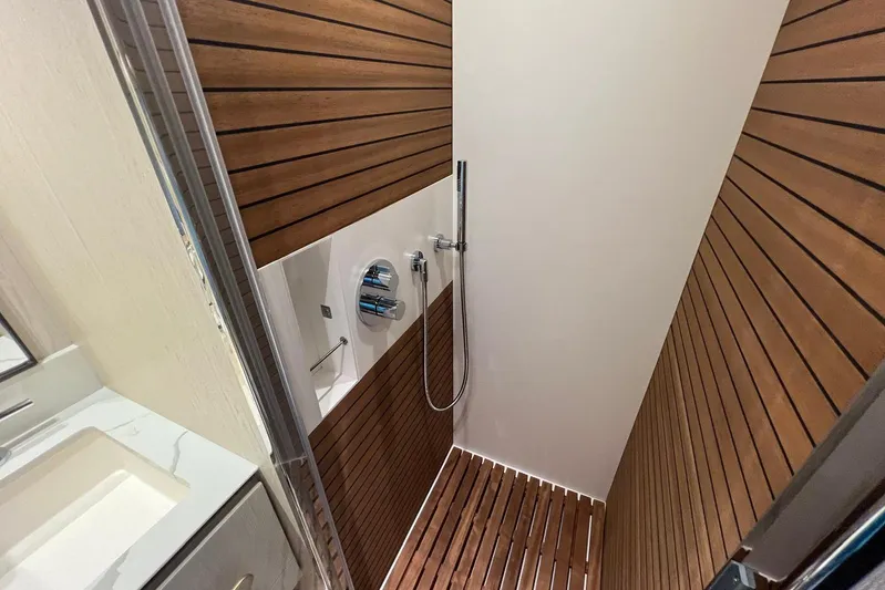  Yacht Photos Pics Luxurious shower with wood paneling in 2020 Azimut Grande 25M yacht.