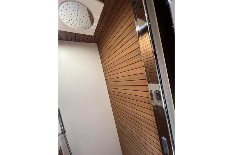  Yacht Photos Pics Luxurious shower area with wood paneling in 2020 Azimut Grande 25M yacht.
