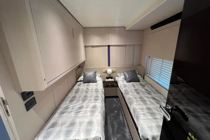  Yacht Photos Pics Luxurious twin bedroom in 2020 Azimut Grande 25M yacht, featuring modern decor and cozy bedding.