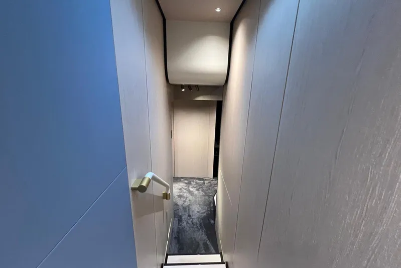  Yacht Photos Pics Interior staircase of 2020 Azimut Grande 25M yacht, featuring modern design and lighting.