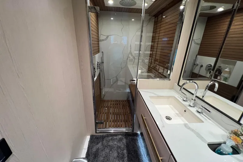  Yacht Photos Pics Luxurious bathroom in 2020 Azimut Grande 25M yacht with modern fixtures and elegant design.