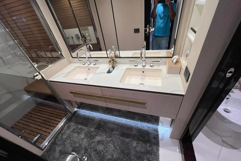  Yacht Photos Pics Luxurious bathroom in 2020 Azimut Grande 25M yacht with dual sinks and modern design.