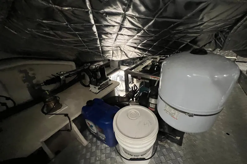  Yacht Photos Pics Engine room of 2020 Azimut Grande 25M yacht with equipment and storage containers.