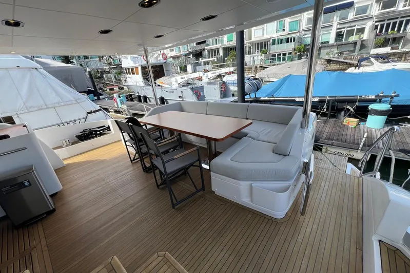  Yacht Photos Pics Azimut Grande 25M 2020 yacht deck with seating and table, docked at marina.