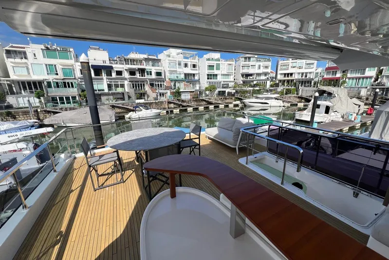  Yacht Photos Pics Luxurious 2020 Azimut Grande 25M yacht docked, featuring spacious deck and modern seating area.