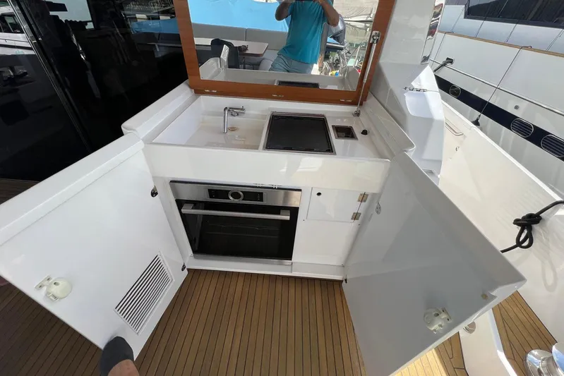  Yacht Photos Pics Outdoor kitchen on 2020 Azimut Grande 25M yacht with sink, grill, and oven.