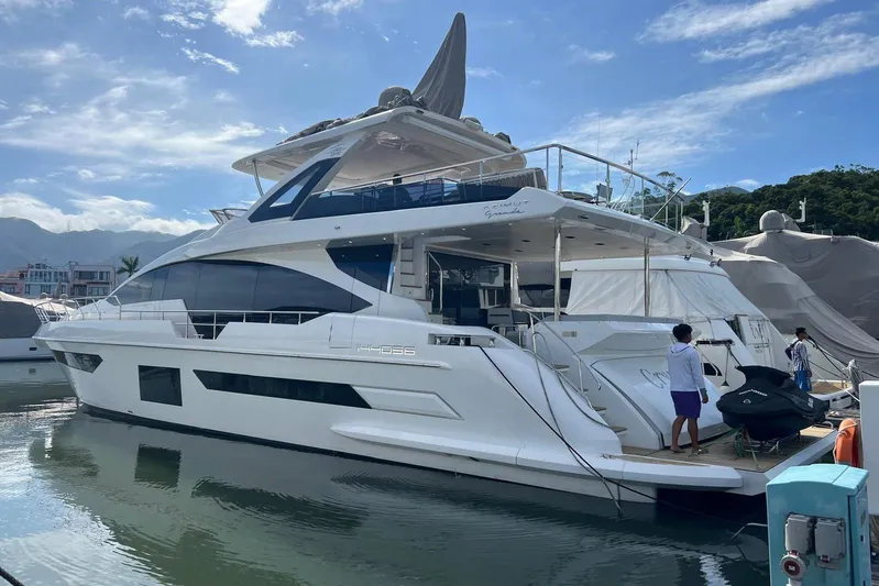  Yacht Photos Pics Luxury Azimut Grande 25M yacht docked, 2020 model, sleek design under a clear blue sky.