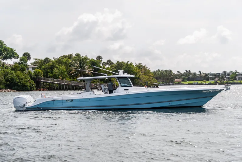 Relentless Yacht Photos Pics 2021 HCB 53 Sueños boat cruising on a scenic waterway.