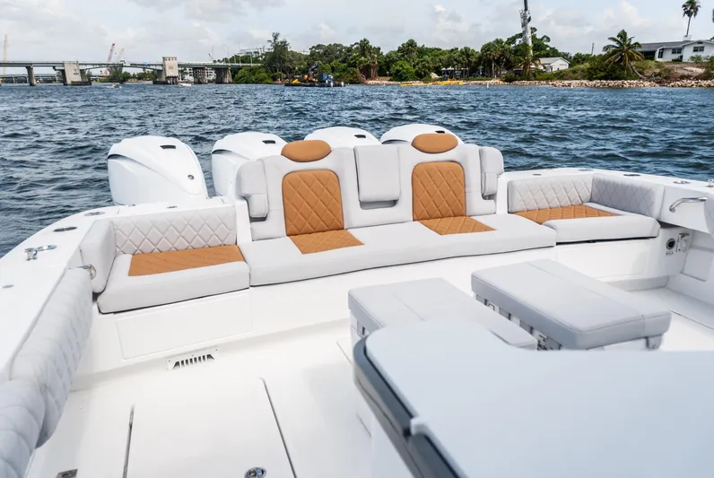 Relentless Yacht Photos Pics Luxurious seating on 2021 HCB 53 Sueños boat with scenic water view.