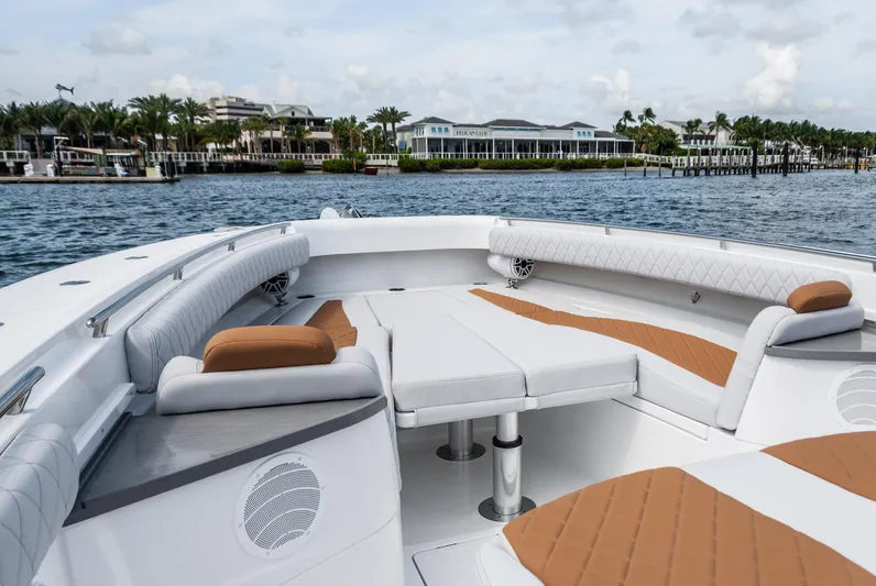 Relentless Yacht Photos Pics Luxurious 2021 HCB 53 Sueños boat interior with elegant seating and waterfront view.