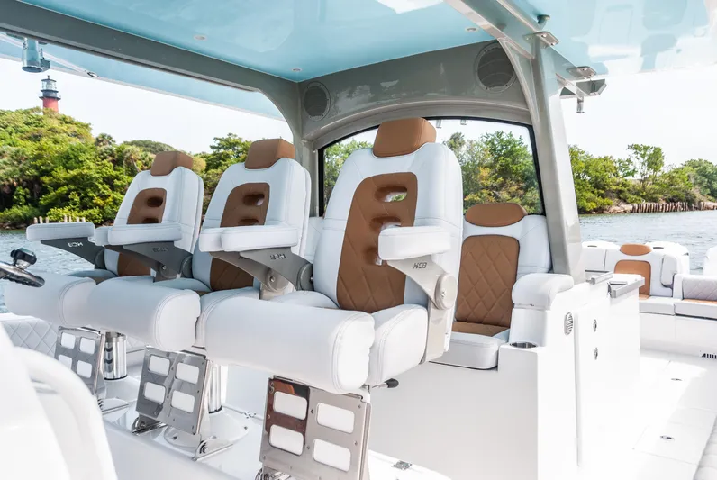 Relentless Yacht Photos Pics Luxury seating on 2021 HCB 53 Sueños boat, featuring elegant design and comfort.