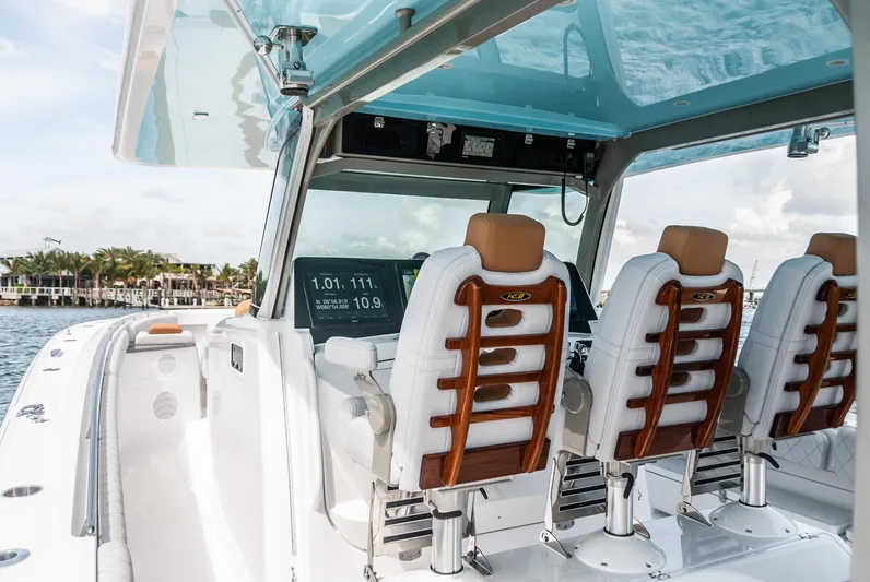 Relentless Yacht Photos Pics 2021 HCB 53 Sueños boat interior with luxurious seating and advanced navigation displays.