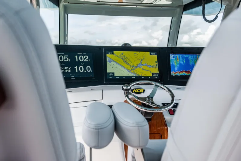 Relentless Yacht Photos Pics Helm of 2021 HCB 53 Sueños with advanced navigation displays and steering wheel.