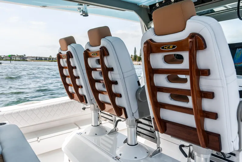 Relentless Yacht Photos Pics Luxury seating on 2021 HCB 53 Sueños boat, featuring elegant design and craftsmanship.