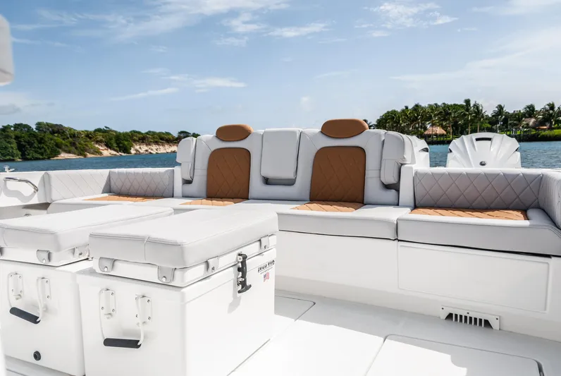 Relentless Yacht Photos Pics Luxurious seating on 2021 HCB 53 Sueños boat with scenic water view.