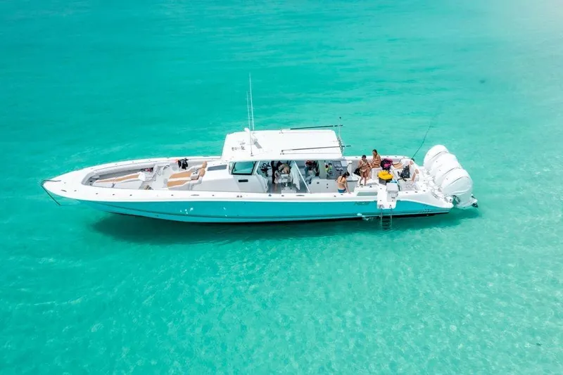 Relentless Yacht Photos Pics 2021 HCB 53 Sueños boat on clear turquoise water, aerial view.