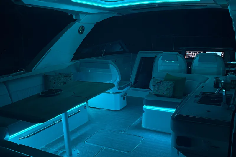  Yacht Photos Pics 2025 Searay 400 SLX yacht interior with ambient blue lighting and modern seating.