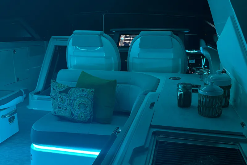  Yacht Photos Pics Luxurious interior of 2025 Searay 400 SLX boat with ambient lighting and seating.