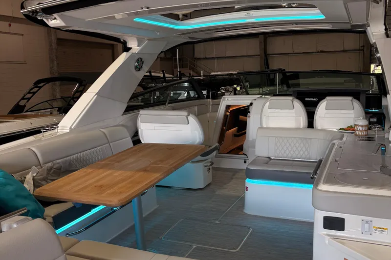  Yacht Photos Pics Luxurious interior of 2025 Searay 400 SLX boat with modern seating and ambient lighting.