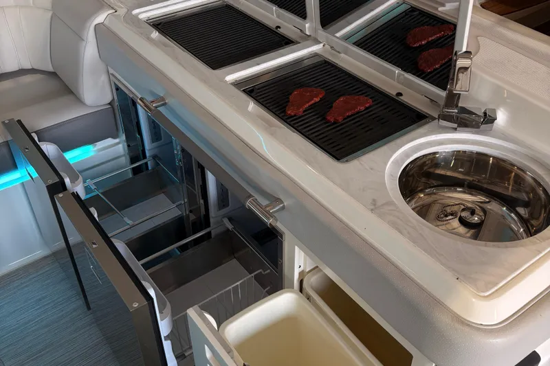  Yacht Photos Pics Luxury kitchen area on 2025 Searay 400 SLX yacht with grill and sink.